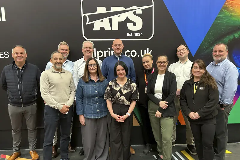 12 of the All Print Supplies sales team members, posing for the camera during a break in May's quarterly sales meeting.