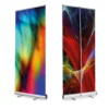 Altona Two roll-up display unit fully extended with a banner graphic printed on both sides showing views of the front and back. The extendable pole if visible from the back of the stand that holds the graphic up and straight.