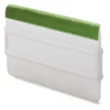 Green velvet self-adhesive replacement squeegee edge strip for vinyl wrapping tools stuck to the edge of a white ribbed applicator tool.