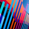 A close-up on self-adhesive vinyl that has been cut into different coloured stripes and positioned into vertical patterns. Created using Avery 200 PF sign vinyl the stripes and colour blocks have been creatively applied to an exterior window for decorative display and signage purposes at a public library.