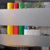 Avery Crystal etch glass effect self-adhesive decorative vinyl is applied to an internal office window in 2 large strips to show how the obscurity/privacy levels of this window film only allows light and vague colours to be visible through the areas that the film has been applied onto.