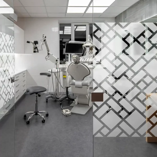 Avery Crystal self-adhesive window film used to deciorate the windows of a dental practice, obscuring views of the offices behind but allowing light through the film to add a touch of style as well as privacy.