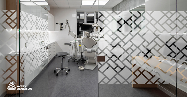 Avery Dennison Crystal glass effect window vinyl with cut film decorative shapes across the internal glass office door and wall providing stylish provacy feature in this dental surgery.