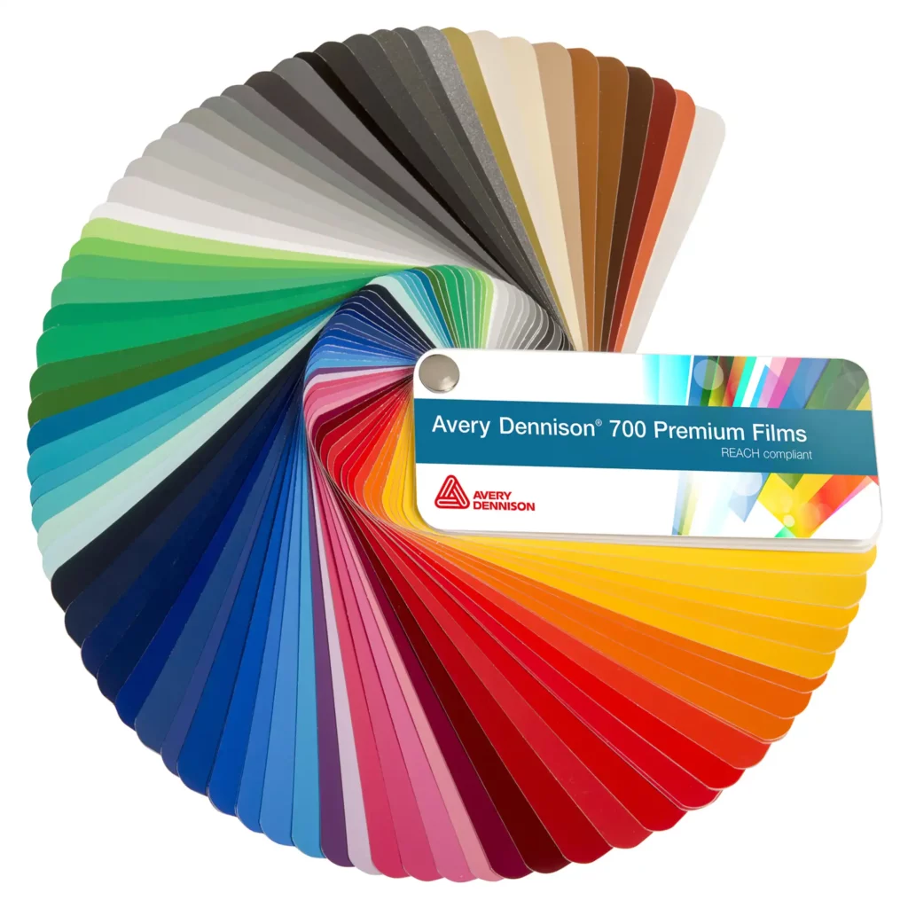 Avery Dennison 700 PF (Performance Film) coloured sign vinyl swatch is fanned out almost 360 degrees to reveal the full series of colour self-adhesive films for cut-vinyl graphics and signmaking.