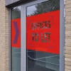 Avery Dennison MPI 2041 clear print vinyl, transparent film that has been printed with a red background and 'To Let' cutout letters weeded out and applied as office window signage.