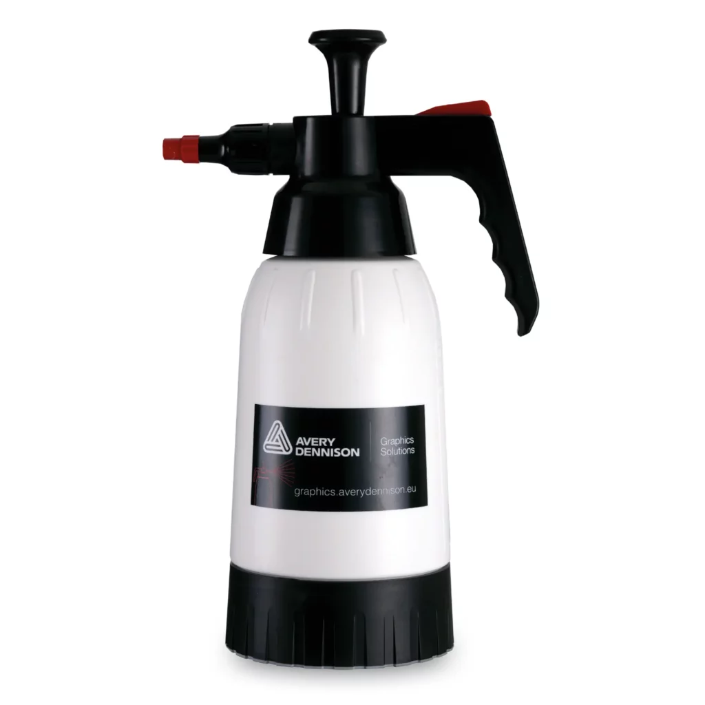 Avery Dennison PPF Slip Solution 1.2L sprayer bottle, a high quality bottle used during wet application primarily for installing Paint Protection Film. Pump action handle is on visible on the top (in the down position) of the large bottle which sucks up fluid into the spray nozzle, along with the thumb trigger button and adjustable spray nozzle.