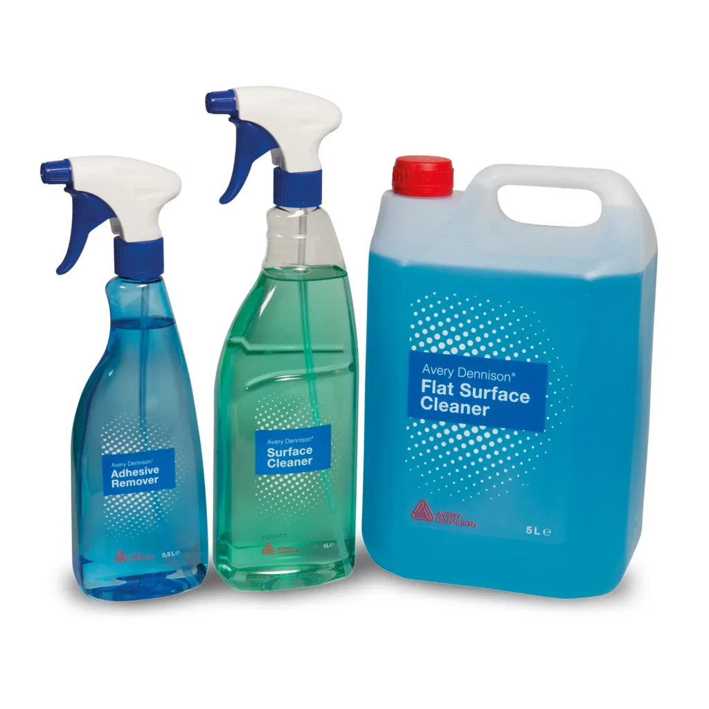 A group shot of the 3 bottles of sign makers fluids from our range of Avery Dennison self-adhesive graphics fluid range. From left to right in the photo: A blue bottle of Adhesive Remover, in the middle Green Surface Cleaner bottle and on the right is a large 5Litre bottle of blue Flat Surface Cleaner.