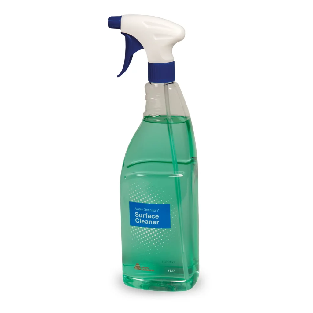Avery Dennisons' surface cleaner in it's 1 Litre teardrop shaped bottle container. You can see the light green cleaning fluid through the transparent container, with its swan-neck/teardrop shape neck grip, complete with an adjustable sprayer nozzle inserted into the top and the blue printed product label ourt front with Avery Dennison branding.