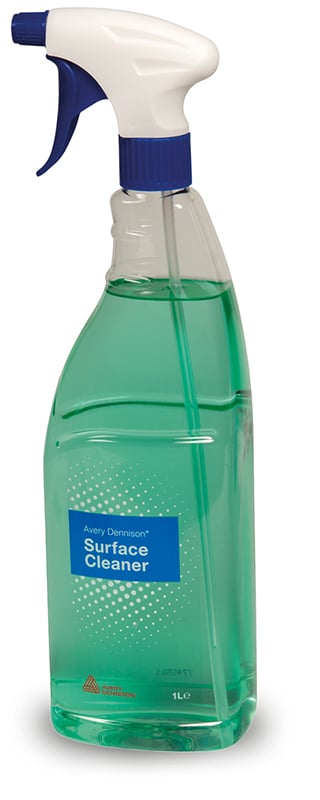 Avery Dennisons' surface cleaner in it's 1 Litre teardrop shaped bottle container. You can see the light green cleaning fluid through the transparent container, with a teardrop shaped neck grip, complete with adjustable srayer nozzle at the top and blue printed label with Avery Dennison branding facing towards the camera.