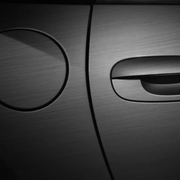 Avery Dennison SWF Extreme Texture Series from the Supreme Wrapping FIlms range includes this stunning brushed black effect self-adhesive vinyl which has been expertly wrapped into all of the intricate contours of the car, completley covering the door handle and peterol cap which are shown in close-up to reveal the fine brush pattern of the film and the colour change in detail, not to forget the flawless application to the vehicle surface!