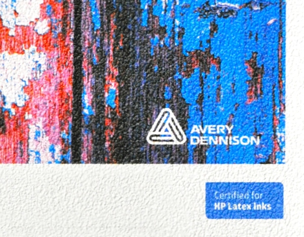 Avery Dennison MPI 8726 Stone textured white self-adhesive wall decoration vinyl shown in close up detailing what the embossed stone like pattern looks like when printed and unprinted.