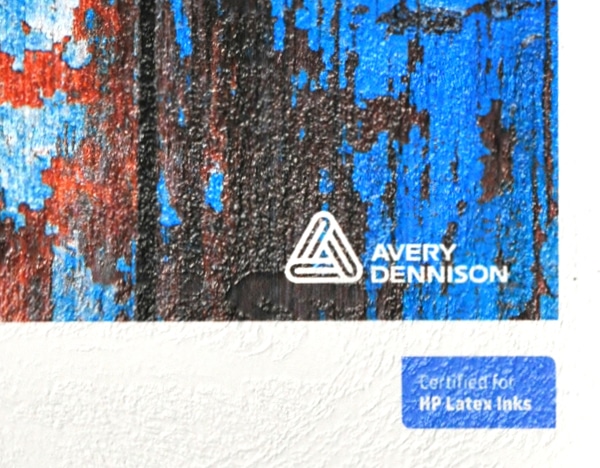 Avery Dennison MPI 8726 stucco textured white self-adhesive wall decoration vinyl shown in close up, detailing what the embossed rough plaster type pattern looks like when printed and unprinted.