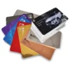 The Avery Dennison Wrapping Films swatch with the 8 Conform Chrome Series of metallic self-adhesive vinyl colour page samples fanned out, distinctly different from the rest of the colour pages inside the closed swatch block.