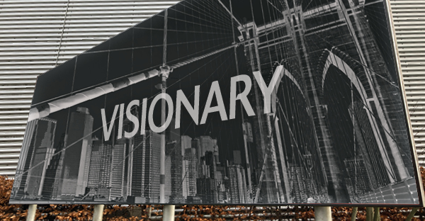 Billboard poster print paper on an advertising hoarding by the side of a road with stylish black, grey and white line drawing and advert text overlaid.