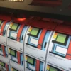 JT 8500 WG-SPB black opaque self-adhesive print vinyl being printed on a Mimaki UV printer with All Print Supplies branded A5 product samples.