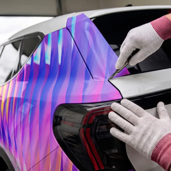 Cast vehicle wrapping laminate DOL 1360 Z and MPI 1103 Smart Wrap+ print vinyl vehicle wrap, with the film being carefully trimmed in the recessed area of the rear boot.