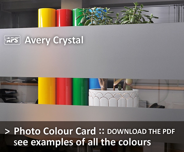 Avery Crystal glass etch window film installed onto an internal office window with a selection of coloured objects behind the window vinyl to show the colour, light transmission and privacy this coloured film provides - Download the photo colour card PDF to see all colour examples of the window decoration films in this range.