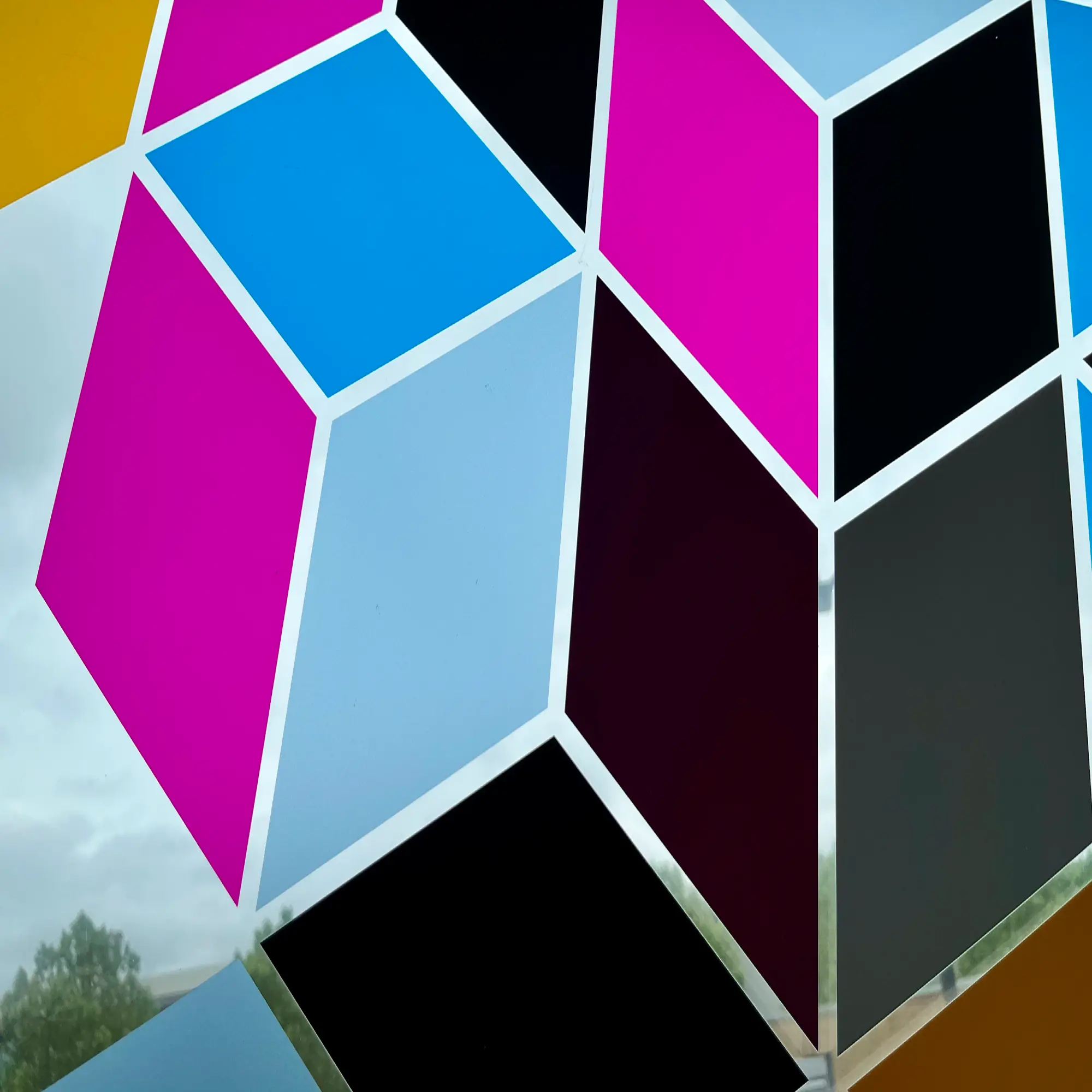 DigiPRINT DS1000 crystal clear provides ultimate clarity for UV printed graphics on windows, as is shown in this image of a printed geometric coloured box pattern that is appled onto the inside of an external window creating a decorative glass design that adds colour with ultimate clarity through the transparent, unprinted areas of the film, for a true 'no vinyl' look where the graphic looks seamlessly printed onto the glass.