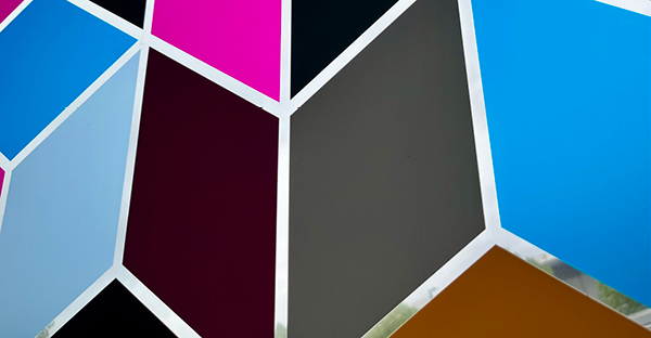 DigiPRINT DS1000 crystal clear offers ultimate clarity on the transparent unprinted areas of this self-adhesive film. The photo shows an internal, decorative window print design of colourful geometric shapes where between the printed shapes buidlings and trees can be seen behind with no visible sign of the vinyl.