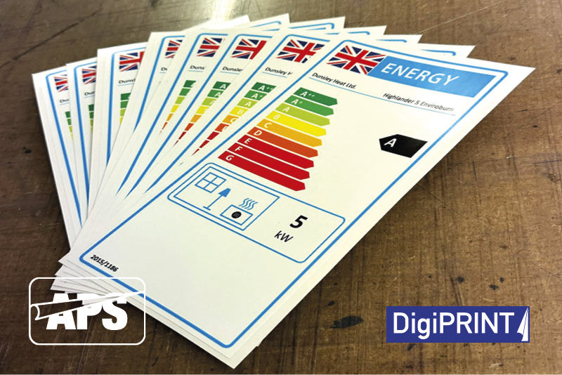 Completed DS3007 self-adhesive print n cut energy efficiency sticker labels stacked and fanned out on table ready for use by the end cusomter for packaging and display information labelling.