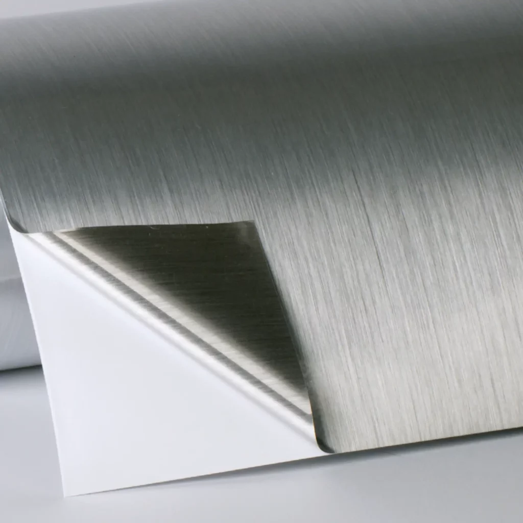 DigiPRINT TSBS3 brushed metallic two-way silver print vinyl roll with one corner peeled back to show the silver effect on both sides of the film.