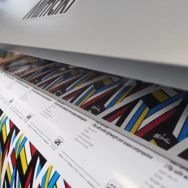 High-quality photo quality printing on DigiPRINT TSSP225 satin photo paper, pictured here with a close-in look at colourful sample prints being produced using a Mimaki digital inkjet printer.