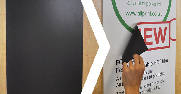 FCP200 satin white ferrous print media being overlaid onto a magnetic backing sheet that is stuck to a wall ready for the quick-change printed graphics to be replaced or overlaid in layers... perfect for signage that needs to be changed quickly, simply and with no mess!