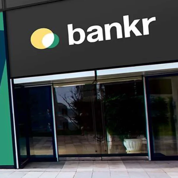Fedrigoni P800 Platinum self-adhesive sign vinyls applied to create corporate signage for a private bank, above the entrance in a high street, using both cut-lettering coloured films and a black overall background.