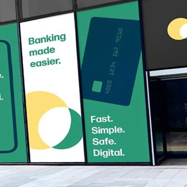 Self-adhesive graphics films from the Fedrigoni P800 sign vinyls range of solid colours have been designed and cut for lettering and simple graphic shapes as exterior window signage, using dark blue, mid-green, yellow and white coloured vinyl.