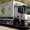 Fedrigoni Platinum Airflow Opaque Series cut sign vinyls applied for truck livery design using green, black and red cut-lettering and various large logos applied to the long flat sides as well as to the slightly curved contours of the cab.
