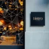 Metallic Gold with Matt Black cut vinyl signage and geometric shaped window decor, created using Fedrigoni's Platinum Series P800 range of self-adhesive sign films for the outdoor decoration of a Bistro Lounge bar.