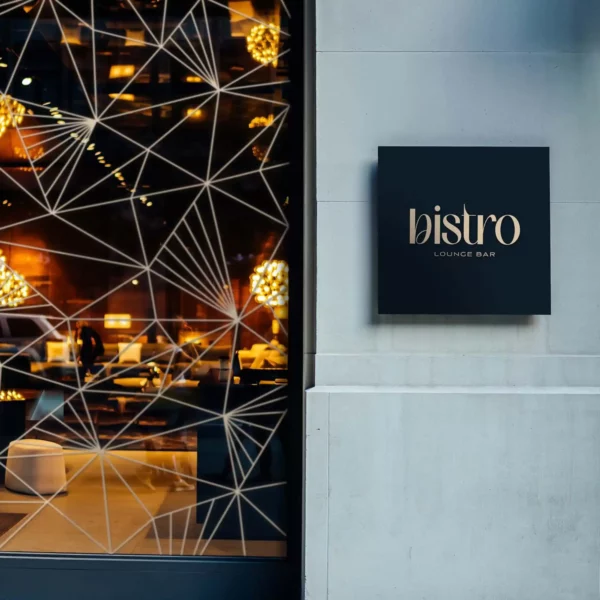 Metallic Gold with Matt Black cut vinyl signage and geometric shaped window decor, created using Fedrigoni's Platinum Series P800 range of self-adhesive sign films for the outdoor decoration of a Bistro Lounge bar.