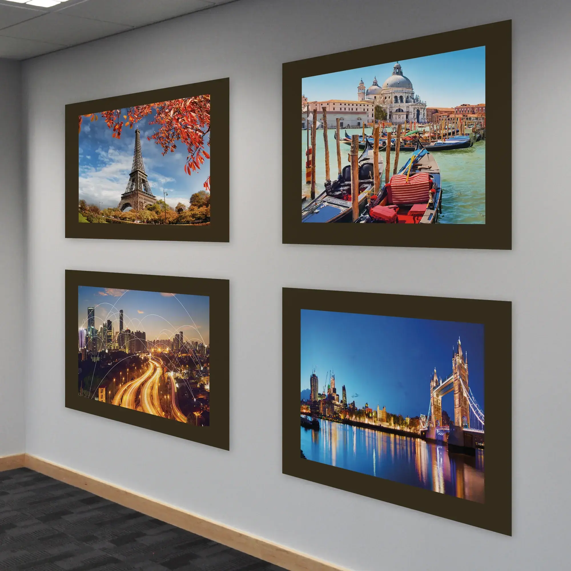 Filmmount FM2 self-adhesive mount film used to mount photographic prints, framed and displayed on a well lit neutral grey wall background.