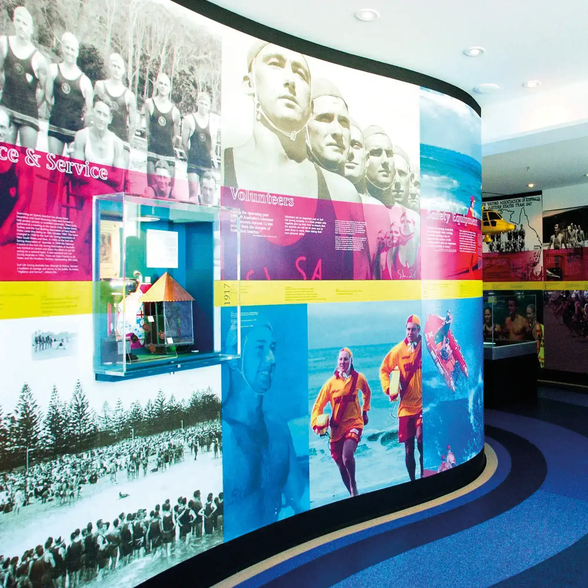 Optically clear self-adhesive graphics mounting film, Filmount Two (FM2) used for backlit mounted prints on this exhibition wall showing an educational life guard history display.