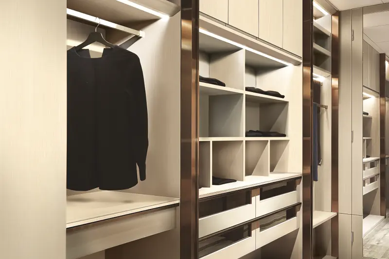 Interior vinyl expertly applied to refurbish all contours of the cabinets, shelves and doors of this large walk-in wardrobe.