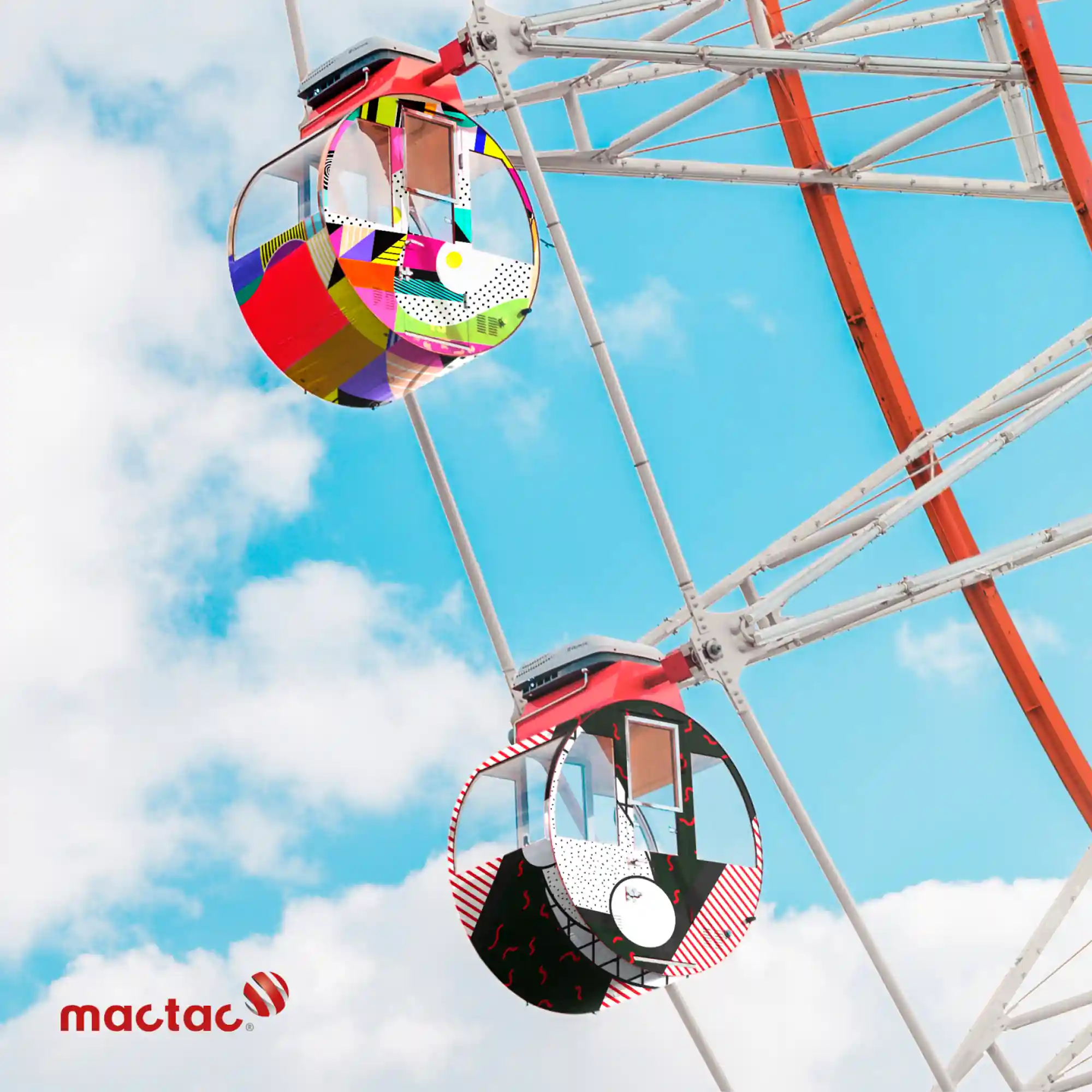 Mactac JT 9500 WG-PG gloss white polymeric print vinyl applied to fareground ferris wheel carriages in bright stripe and dot pattern designs.