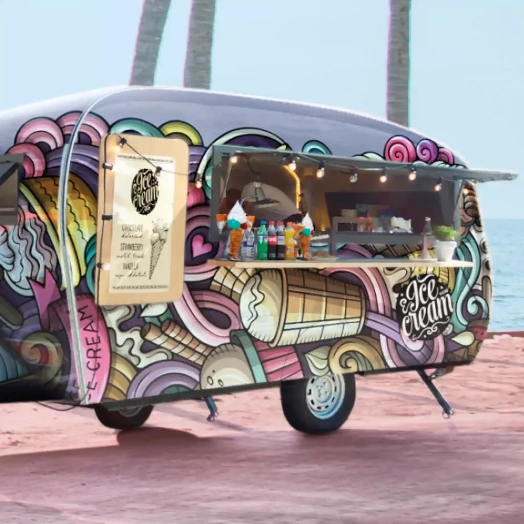 Mactac JT 9700 polymeric self-adhesive print film has been applied to the flat and slightly curved surfaces of this ice cream caravan/trailer stall selling it's wares on a beautiful beach front.