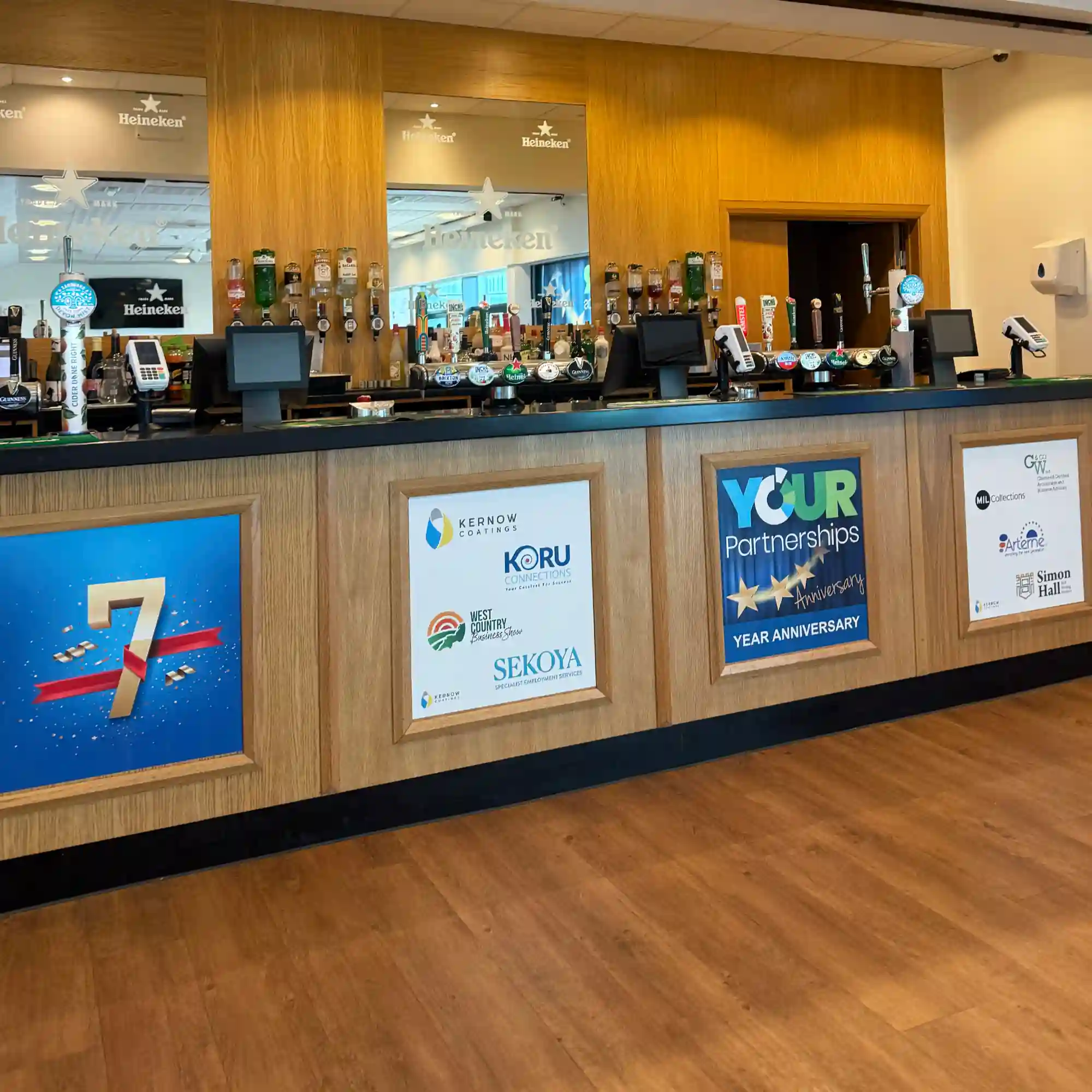 Wall posters applied to the front of a bar for promotional advertising, using Kernow EventSharK print media.