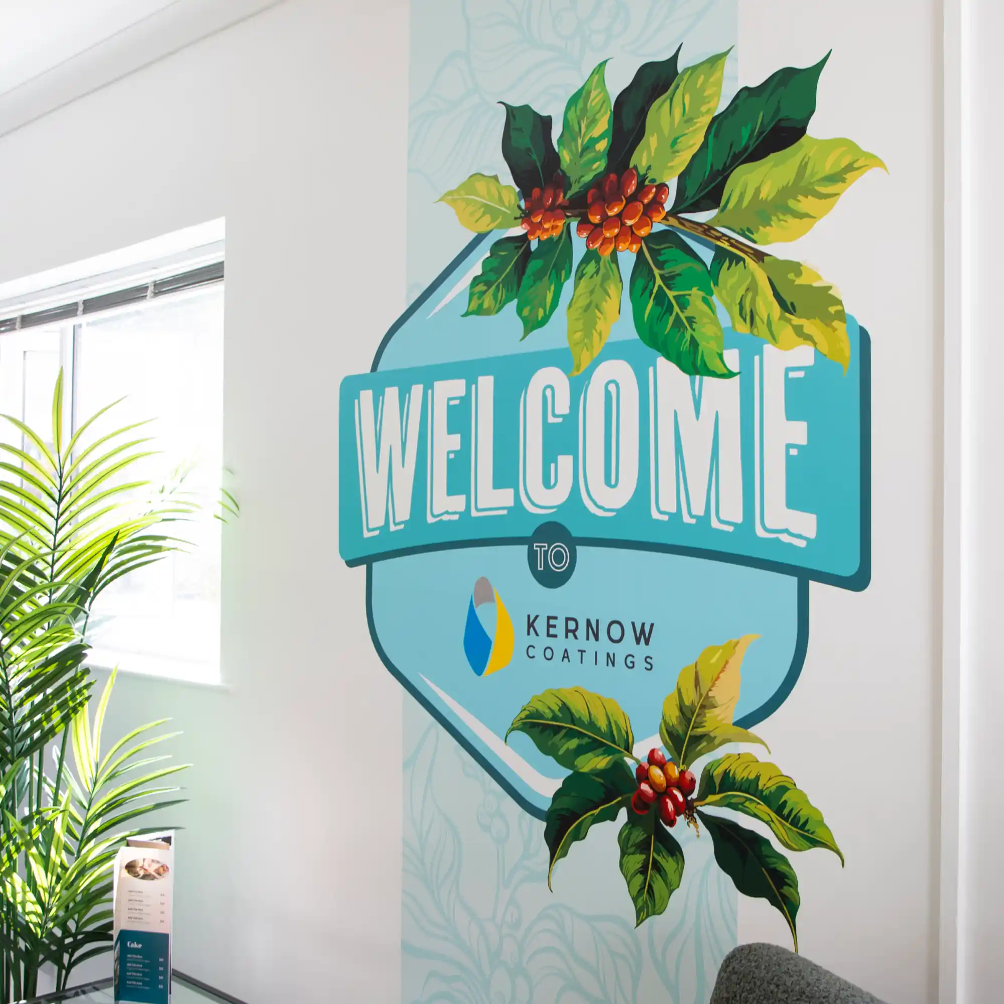 EventSharK print media printed with WELCOME messaging graphics, applied to the walls of the Kernow marketing suite.