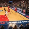 Printed floor advertising graphics using Kernow EventShark surround the courtside areas of a professional basketball arena.