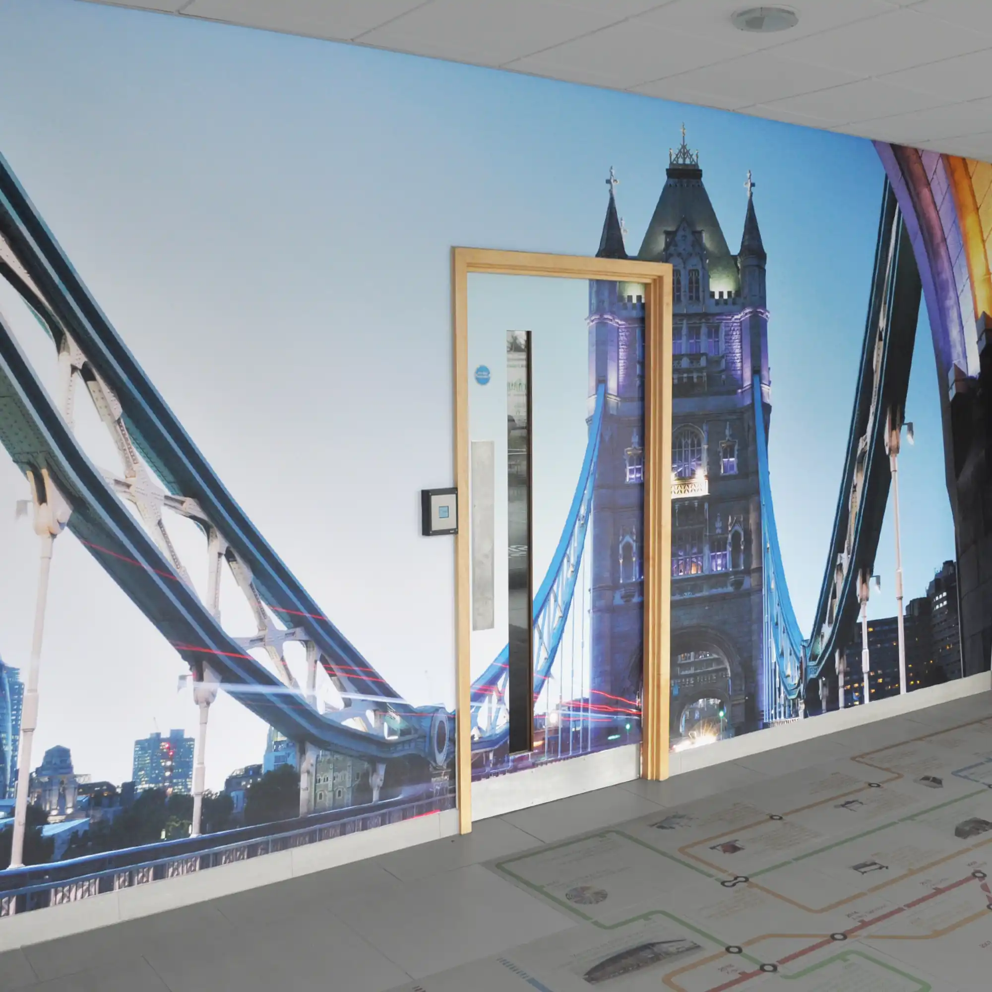 Krea Royal Majestic 1025-11 display print textile used for this lobby wall covering with a London Bridge graphic to compliment the modern bespoke designed room decor.