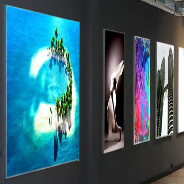 KREA Speedy 911-11 fabric display print media digitally printed and wall mounted into backlit light frames for vibrant art prints in an art gallery exhibition setting.