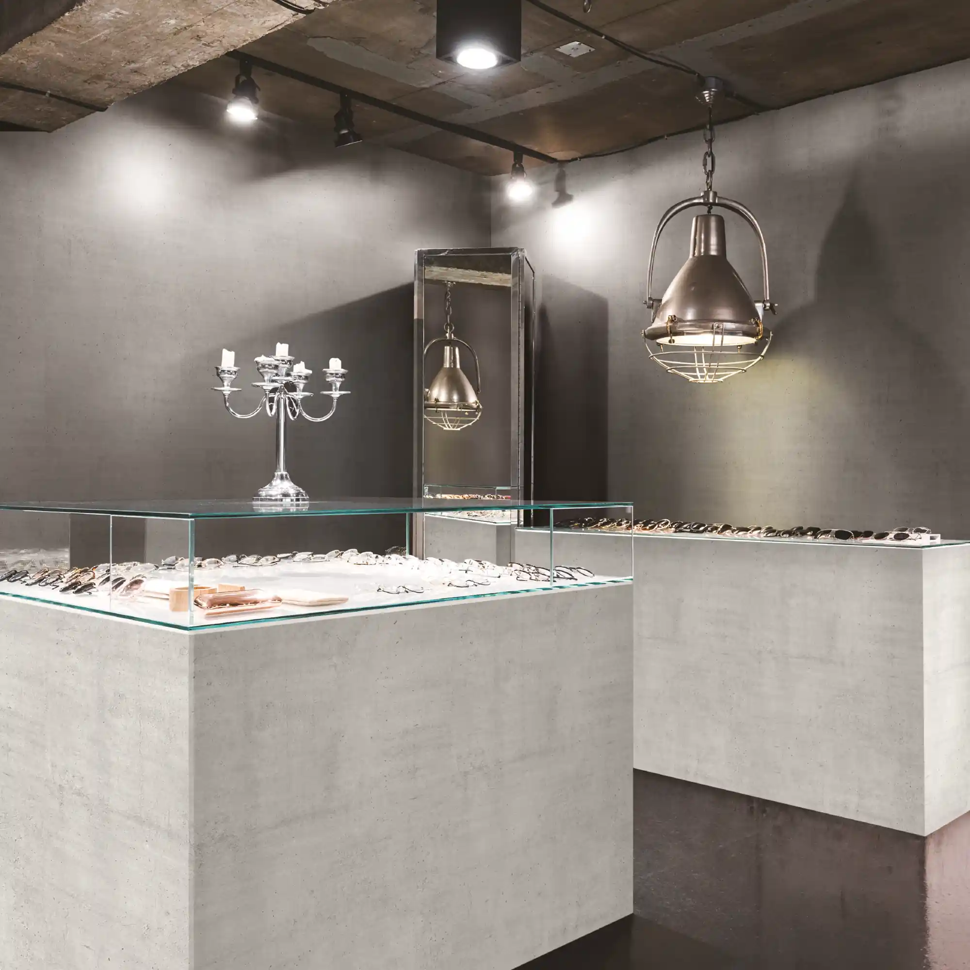 LX BENIF marble and stone interior films from the ML and RM range of self-adhesive film, with the complimentary finishes and textures used to cover a set of retails jewelry display cases and the surounding walls.