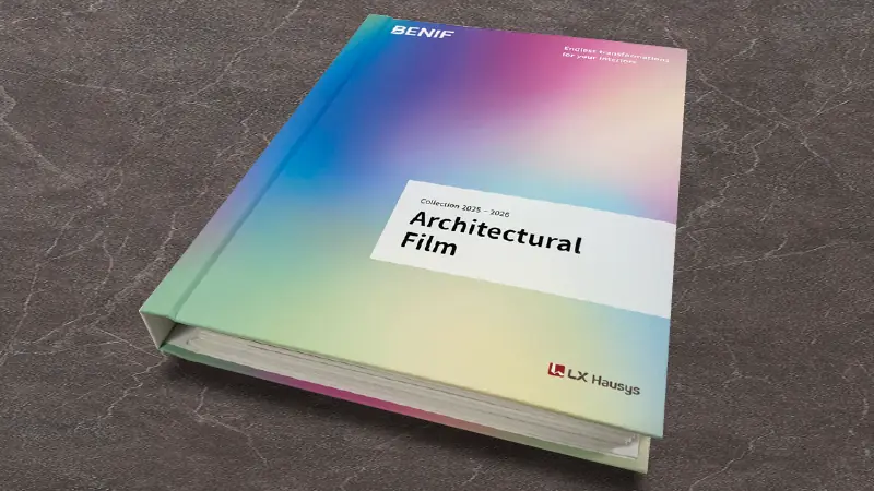 LX Hausys BENIF Interior Films, complete product range 2025-2026 brochure cover, laid down with cover closed on top of a dark grey marbled table top background.