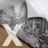 NU-COAT M12-H-X high opacity, cover all, print vinyl with a high grab airXit (bubble-free) adhesive is applied here to an interior office wall with a large format print of a black & white historical photograph of a machine factory floor from a bygone era, with belt driven power. This self-adhesive graphic film is perfect for wall applications due to the extra strength of the adhesive that will stick to difficult surfaces.