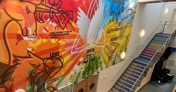 Wide format printed vinyl, M15-H with high grab adhesive, applied to an interior school wall, decorating this large area with a bright, inspirational and educational graphic.