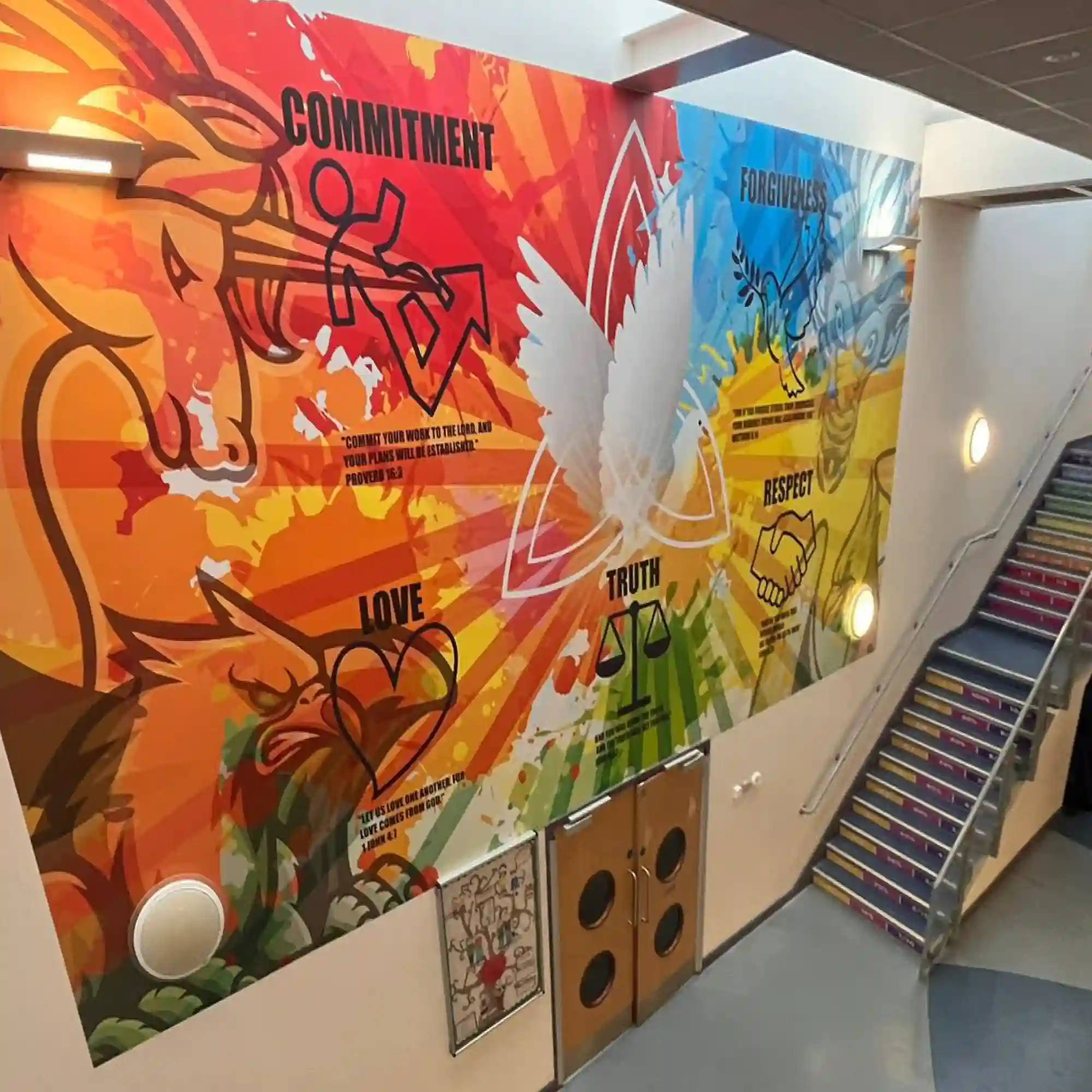 M15-H HighGRAB self-adhesive wide-format vinyl is shown here printed with a brightly coloured graphic design that uses text and line art images to display this school's values of "commitment", "forgiveness", "love", "truth" and "respect" and it has been applied to cover across multi-levels of this school reception wall.