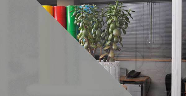 M73-W-P deep frosted glass effect window vinyl half applied onto interior office glass to give a representation of the privacy and colour this deep textured frost film offers.