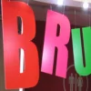 MACal 8000 fluorescent coloured self-adheive sign vinyls pictured here applied to cutout letters that are hung from the ceiling to create a brightly coloured hanging display that stands out from it's surroundings.