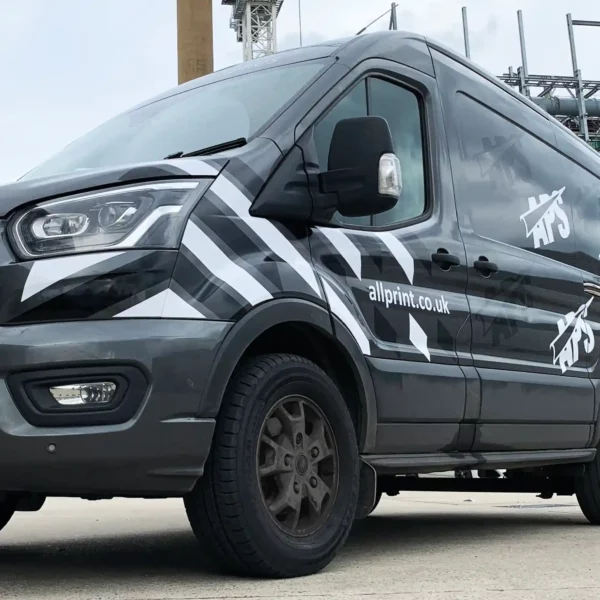 MACal 8300 used for cutout logo branding on the flat sides of a company delivery van, with additional vinyl sign graphics spaced around the logos for decorative effect.